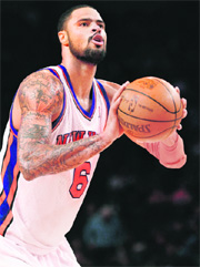 Tyson Chandler of New York Knicks shoots against New Jersey Nets during their preseason game in New York City on Wednesday. NYK won 88-82. 