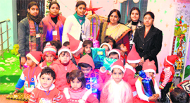 Kindergarten students of Shemrock Riverdale School during the Christmas celebrations in Haridwar on Friday.