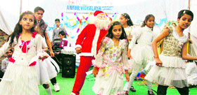 Students perform a stage show during the Christmas celebrations at Ankur Vidyalaya in Jammu on Friday.