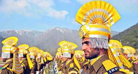 Personnel of the Jammu and Kashmir Armed Police take part in the passing-out parade in Baramulla on Friday