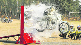 Daredevils of Army Service Corps, Bangalore, display stunts during the golden jubilee celebrations of the Old Boys' Association of Sainik School, Kapurthala, on Friday.