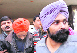 Sarabpreet and Jaswinder, two suspected terrorists of Babbar Khalsa, at a court after their arrest in New Delhi on Friday.