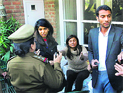 The accused explain themselves to a woman police officer following a property dispute in Chandigarh on Saturday