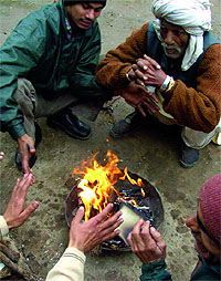 With the mercury dipping to the lowest of the season, some sought refuge in bonfires