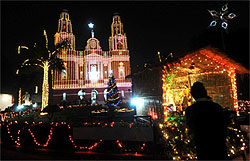 Gol Dakkhana Church is illuminated on the eve of Christmas in New Delhi on Saturday