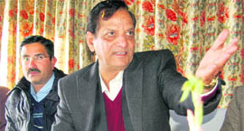 Industries Minister Kishan Kapoor addresses mediapersons in Dharamsala on Saturday. 