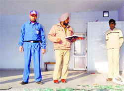 Police investigate the petrol station where robbery was committed in Ludhiana on Saturday.