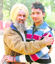 Manvir Singh with his father Rajpal Singh in Ludhiana on Saturday.