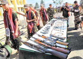 Cadres of 21 militant outfits surrender with their weapons at a ceremony in Leimakhong Sadar Hills district, Manipur on Saturday