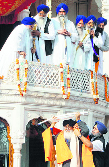 Chief Minister Parkash Singh Badal being bestowed 'Fakhr-e-Quam Panth Rattan' at the Akal Takht in Amritsar