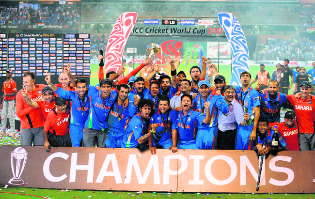 Indian players celebrate with the trophy after winning the 2011 Cricket World Cup in Mumbai. India beat Sri Lanka by six wickets to lift the cup
