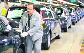 A file picture in Douai, northern France, shows workers of the French car manufacturer Renault working on an assembly line of the Scenic car. It is one of the key engines of the French economy and a historically vital industry, but France's auto sector is heading into 2012 amid dire forecasts for its future and warnings of major job losses.