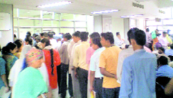 Patients stand in an OPD queue in a hospital in Chandigarh.