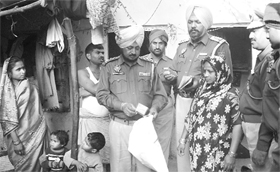 Policemen check the identity cards of Jagatpura residents in Phase XI of Mohali on Sunday.