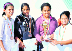 Winners all smiles after winning tennis trophy in Chandigarh on Sunday. 