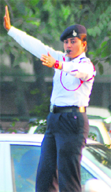 A newly recruited traffic police personnel regulates traffic at one of the junctions in Chandigarh