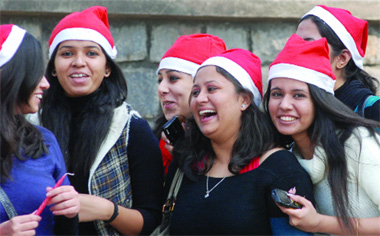 A group of girls celebrate christmas at the Sacred Heart Cathedral on Sunday