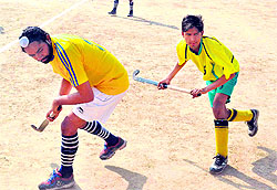 Hockey players in action during the second day of the All-India Swami Shraddhanand National Hockey Tournamnet at Gurukul Kangri University in Haridwar on Sunday