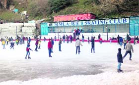 Tourists and residents enjoy ice-skating at Asias oldest natural ice-skating rink in Shimla on Sunday