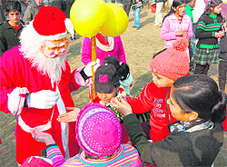 Children revel in the Christmas spirit with Santa Claus in Srinagar on Sunday