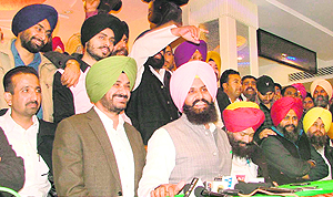 Youth Akali Dal district president Simarjit Singh Bains (in pink turban) addresses a press conference in Ludhiana on Sunday
