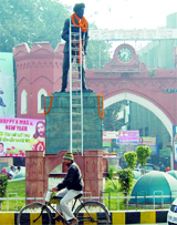 After paying tributes to Shaheed Udham Singh, people fail to remove the ladder put up for garlanding the statue outside Hall Gate in Amritsar on Monday.