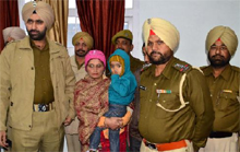 The police team with the child that was kidnapped by the familys acquaintance and recovered from Bhucho Mandi in the wee hours on Monday. 