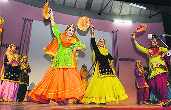 Girls perform giddha during the youth festival at Panjab University in Chandigarh.