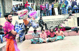 Artistes from Chandigarh perform in a play Khule Aam Share Aam in Shimla on Monday. 