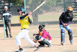 A player plays a shot during the Inter-College Softball Championship in Chandigarh on Tuesday. 