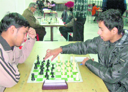 Players make a move during the Chandigarh Team Chess Championship in Chandigarh on Tuesday. 