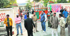 BJP workers and leaders outside the BJP state headquarters in Dehradun on Tuesday.
