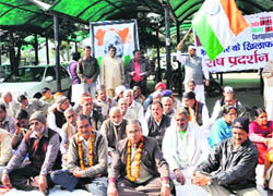 Protesters stage a dharna in front of the mini-secretariat in Kurukshetra on Tuesday. 