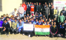 Students and Congress workers during the centenary celebration of Jana Gana Mana at Rait in Kangra district on Tuesday.