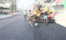 Work on a road in Model Town market in full swing on Tuesday.