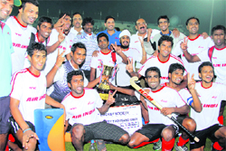 A file picture of the Air India team players after winning the 28th Surjit Hockey tournament held in Jalandhar. 
