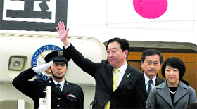 Japanese PM Yoshihiko Noda, accompanied by his wife Hitomi Noda, waves on arrival at Air Force Station, Palam, in New Delhi on Tuesday.