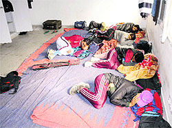 Softball players from Ludhiana lie on a mat-covered floor at room 22 of the Panjab University sports hostel in Chandigarh