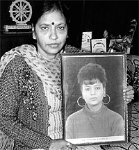 Complainant Madhu Parkash along with the portrait of Ruchika at her residence in Panchkula on Wednesday