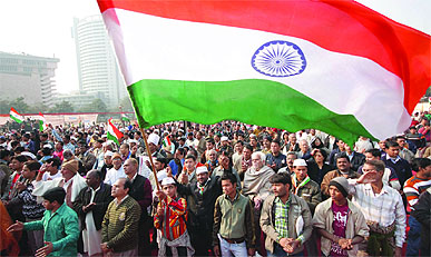 Supporters of anti-corruption activist Anna Hazare during a protest for a strong Lokpal Bill at Ramlila Grounds in New Delhi on Wednesday.
