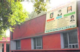 A hoarding of senior leaders of the SAD on the PSEB's regional depot building. This picture was taken on Tuesday and the hoarding was removed on Wednesday by the election authorities