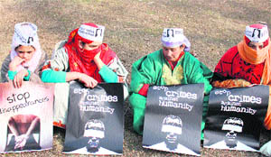 Relatives of disappeared youth stage a protest in Srinagar on Wednesday.