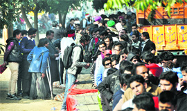 Youngsters wait for their turn during the auditions outside the Lodhi Club in Ludhiana.