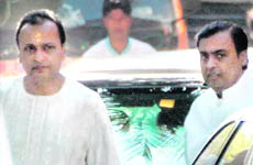 Mukesh Ambani and Anil Ambani in their hometown of Chorwad on Wednesday