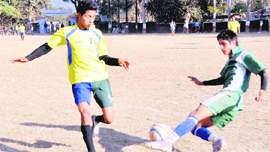 Players in action in a match in the Amar Shaheed Kharag Bahadur Bisht Memorial Football Tournament in Dehradun on Thursday.