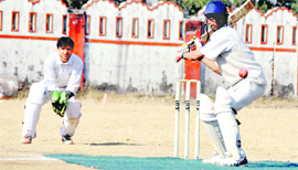 A batsman in action in a match in the 60th Dehradun District Cricket League in Dehradun on Thursday.