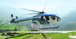 A helicopter takes off with tourists at Kothi village on the Manali-Leh highway on Thursday.