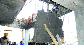 The site where a cement slab in a building on the Dharamsala-Hoshiarpur national highway collapsed on Thursday.