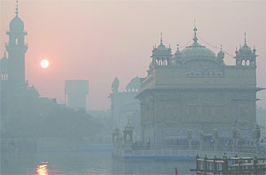 A view of the Golden Temple on a foggy day in Amritsar on Thursday