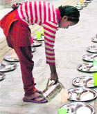        Poonam, a class II student, serves at the camp. 